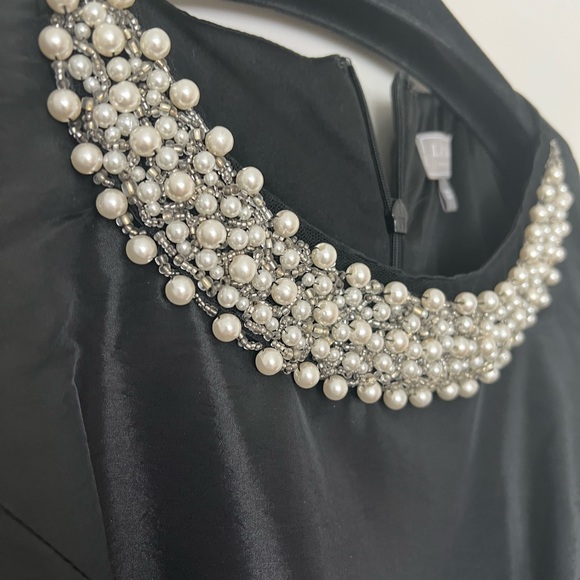 Sleeveless black dress with beaded detail at neckline - Picture 3 of 4